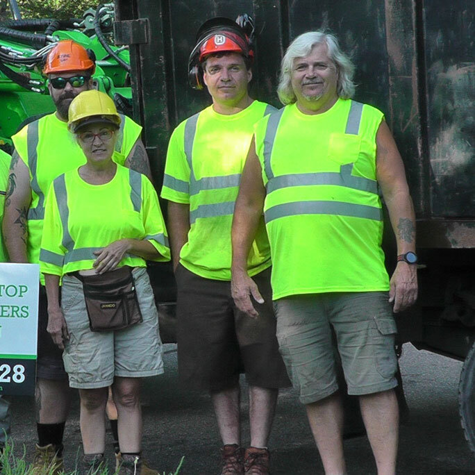 Tree Top Climbers crew in front of truck